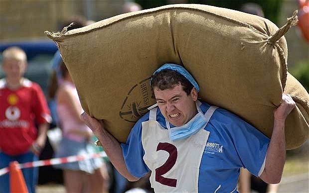 Woolsack carrying. From The Telegraph.